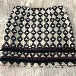 Black and white mini skirt with fringe trim